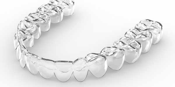 3d render of invisalign removable and invisible retainer over white background